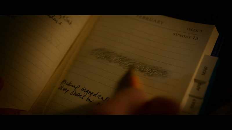 [scribbling on paper]