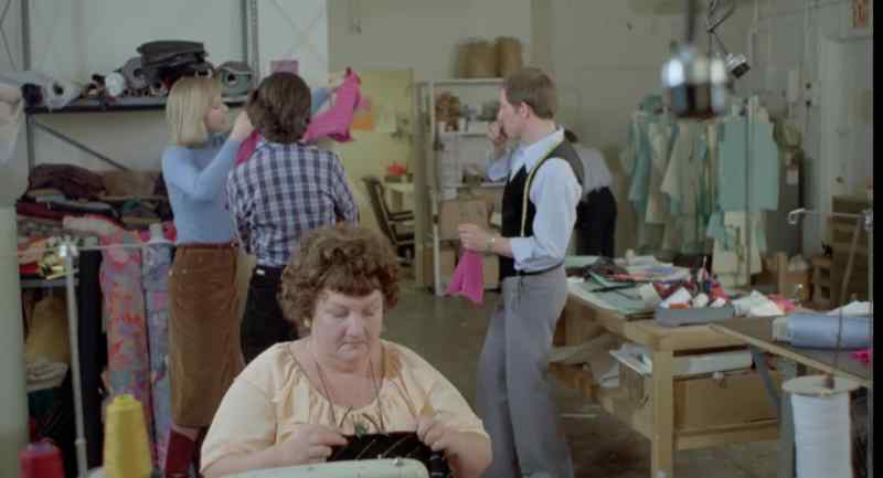 [sewing machines whirring]