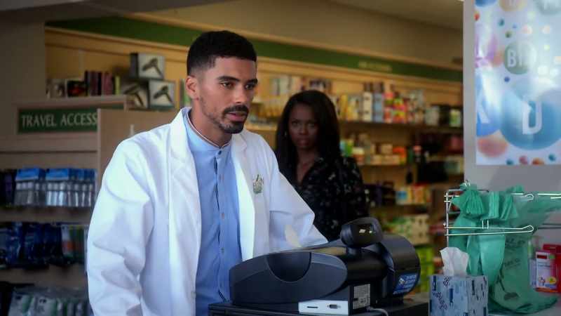 Sharon: Where's my lab coat? Kareem: It's in the back