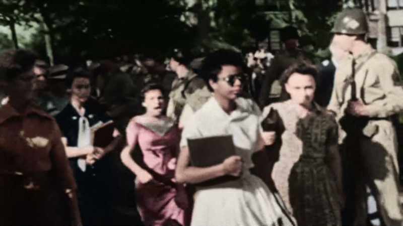 SHE IS FOLLOWED BY AN ANGRY CROWD