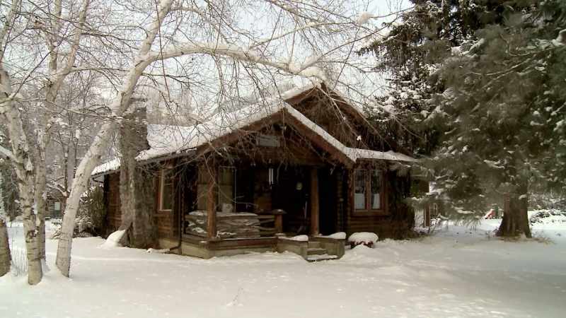 She lives in a beautiful log cabin