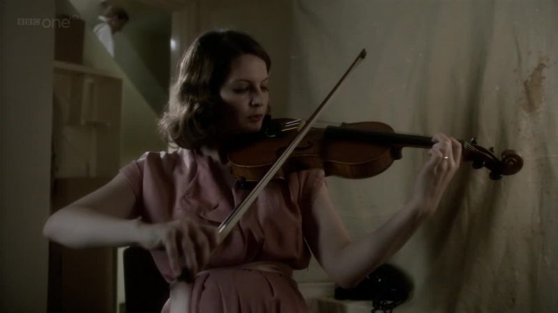 SHE PLAYS A SAD MELODY