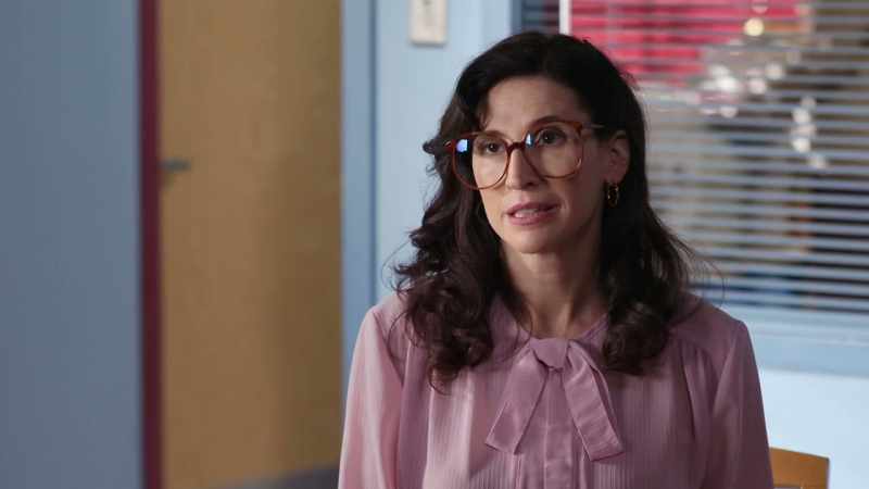 She wears glasses that are clearly