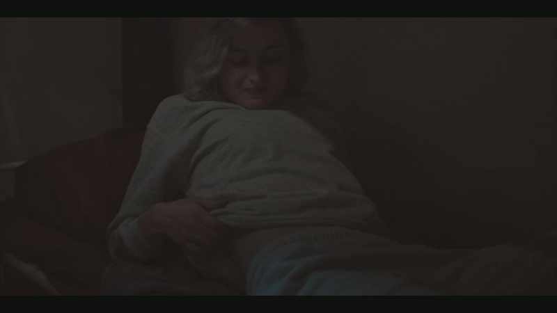SHE WINCES, SIGHS