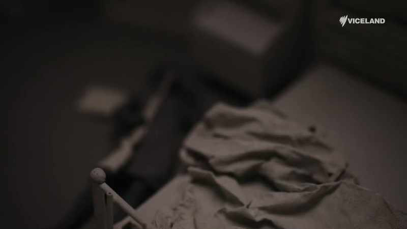 Sheila, on the floor alongside the bed