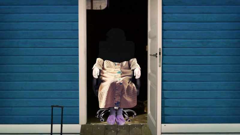 She's wearing slippers, a house coat