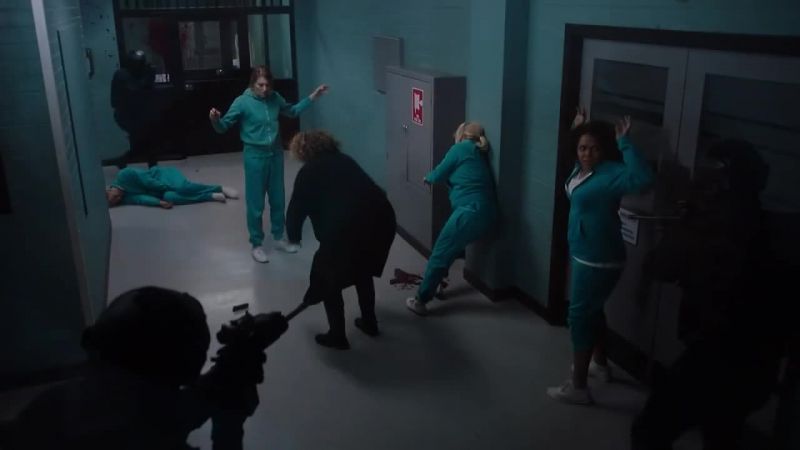 (SHOUTING) Everyone get on the ground!