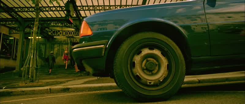 Simultaneously,the man in red shoes parks outside. The time is exactly 11:40 a.m