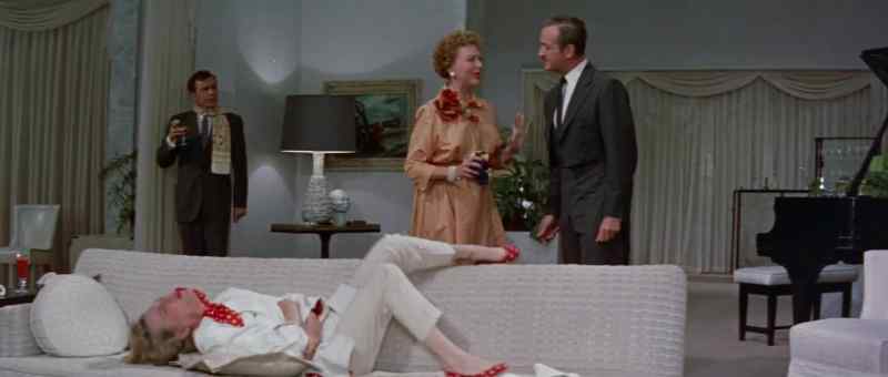 Sit down beside her so she can look at you and touch you