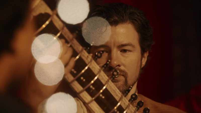 [sitar music]