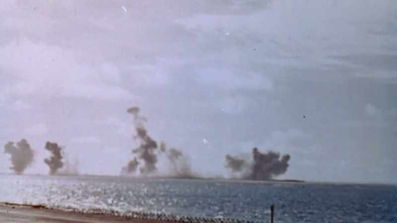 SMOKE BILLOWS HIGH INTO THE SKY