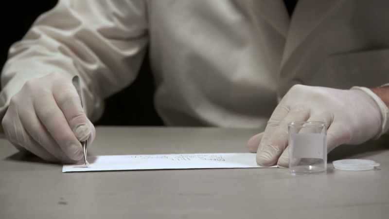 SNEED SENDS THE LETTERS TO THE CRIME LAB
