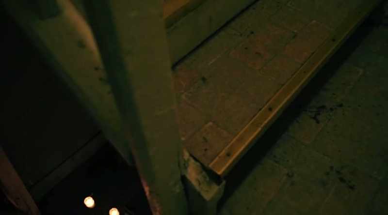 So who buried these objects under the stairs?