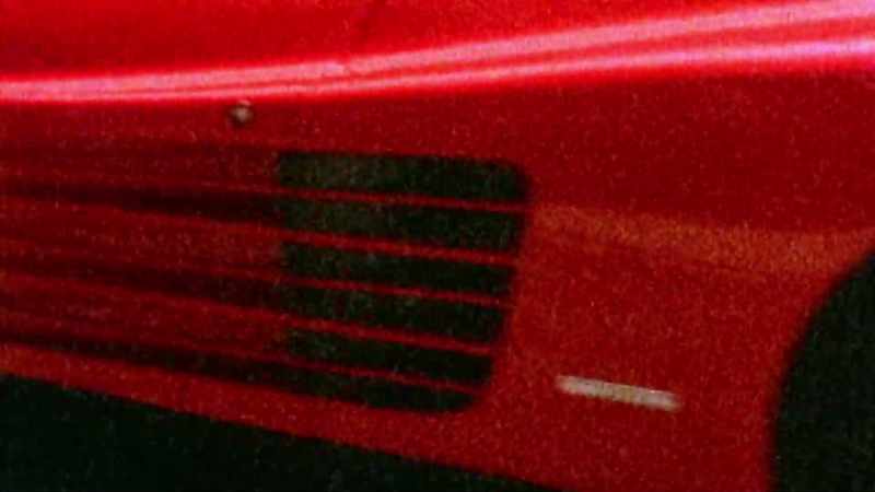 So here Oleg is, pulling up in this red Ferrari