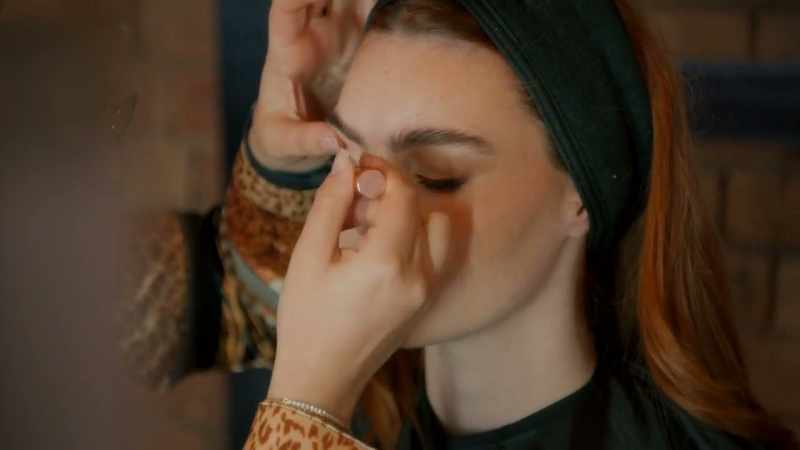 So, I'm pulling her lashes outwards