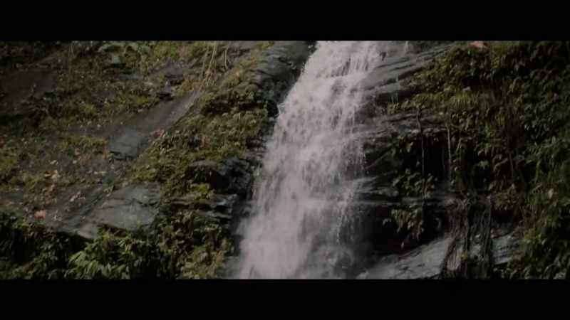 (soft melodic music) (waterfall gushing)