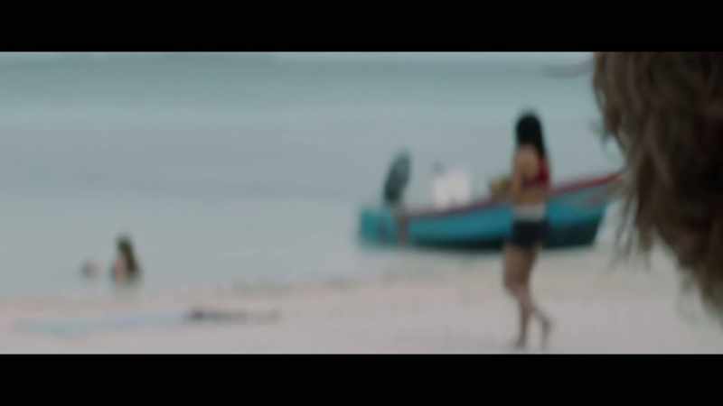 (soft melodic music) (waves lapping)