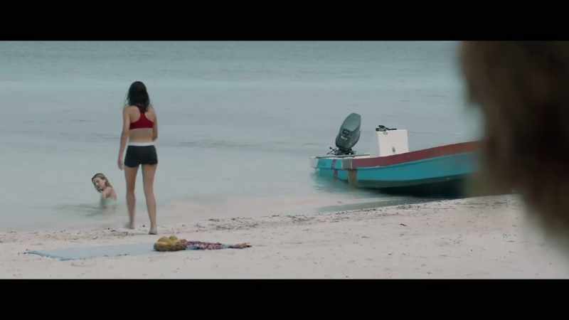 (soft melodic music) (waves lapping)