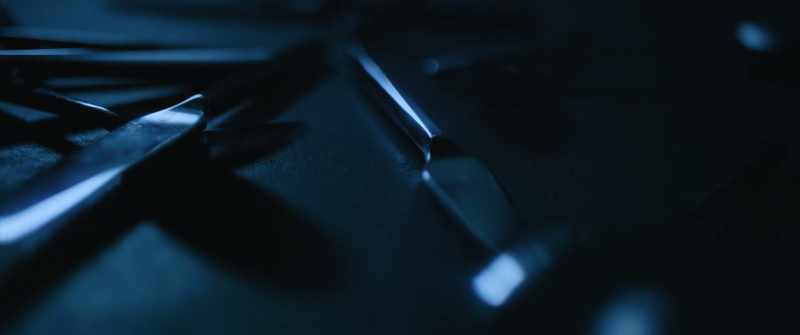[soft ominous music] [cutlery clattering]