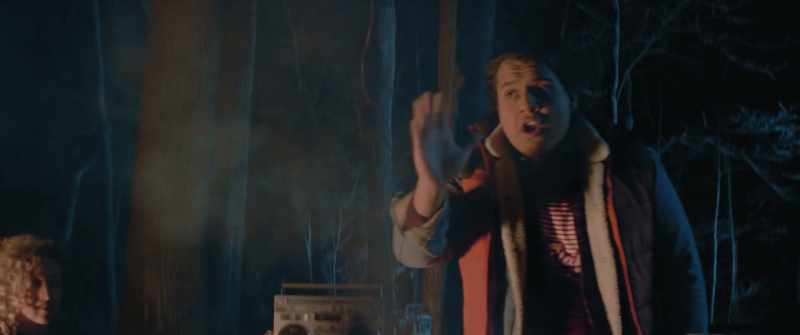 [soft tense music] [fire crackling]