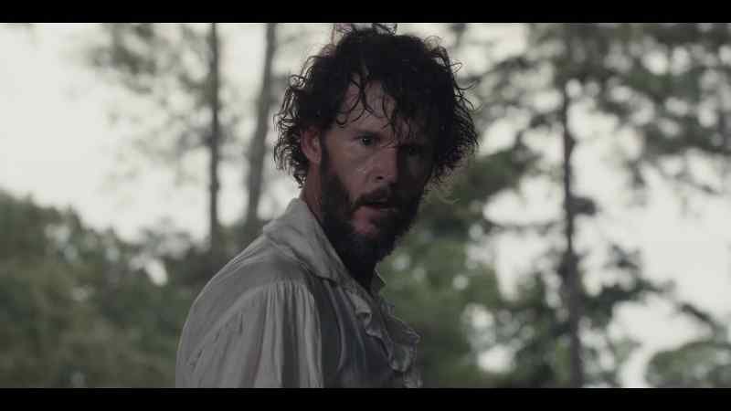 (somber music playing)