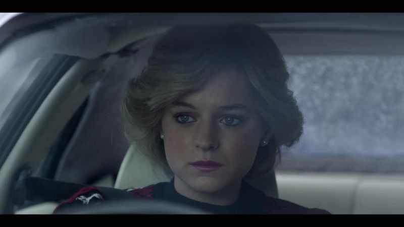 [somber music playing]