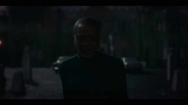 [somber music playing]