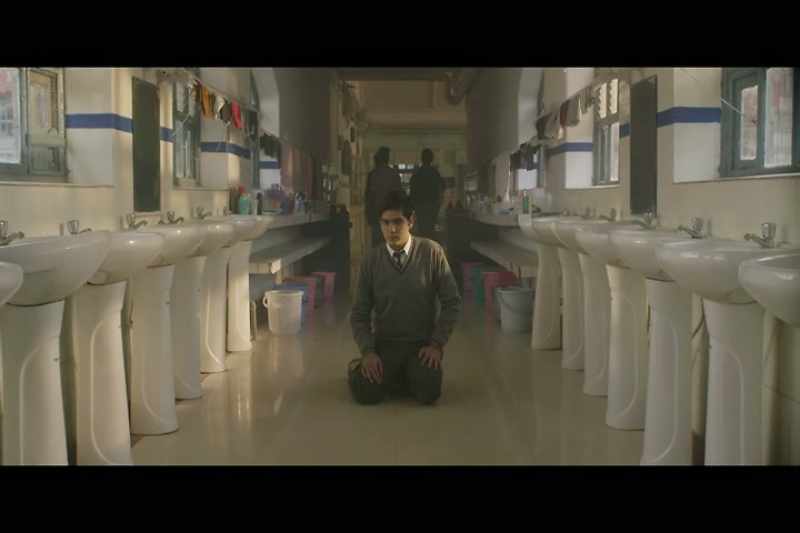 [somber music playing]
