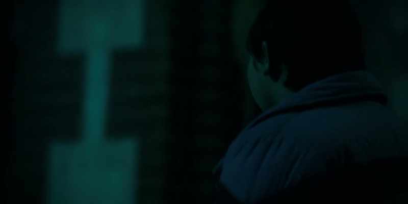 [somber music playing]