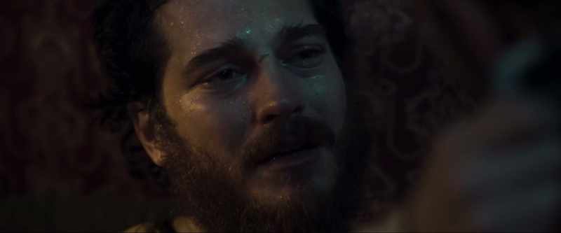 [somber music plays]