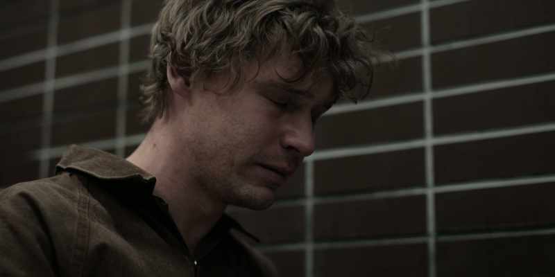[somber music]