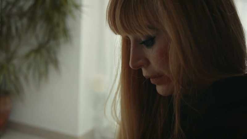 [somber music]