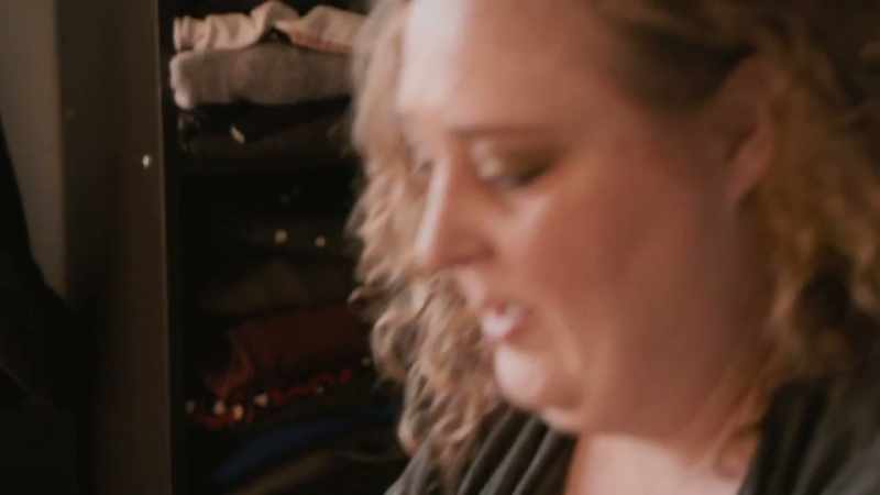[somber music]