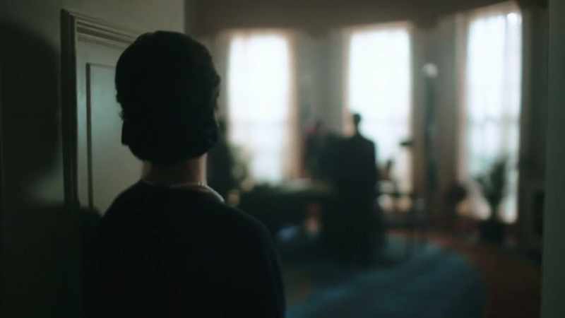 [somber music]