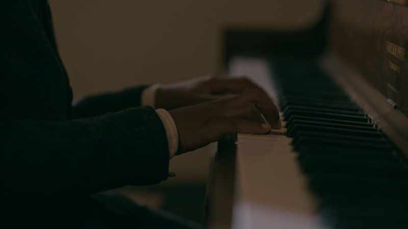 (sombre piano music)