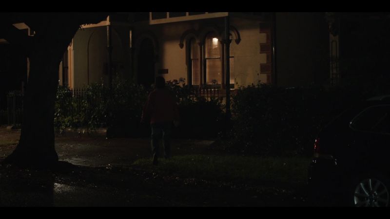 (SONG PLAYS FAINTLY INSIDE HOUSE)