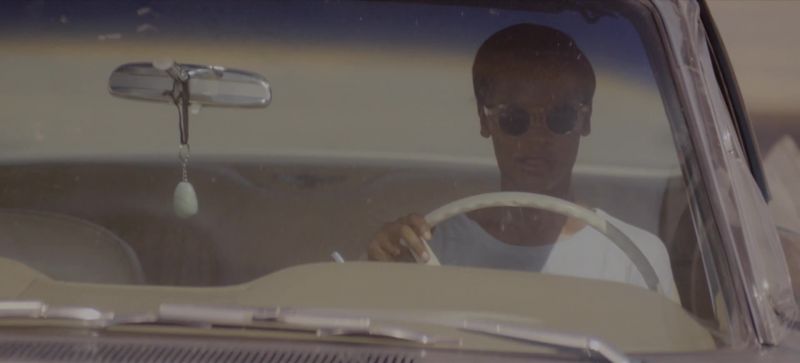 [song resumes on radio]