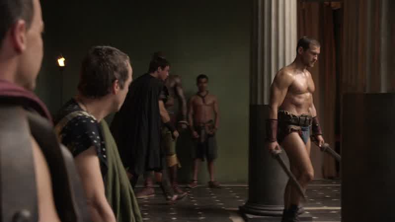 Spartacus wields practice swords