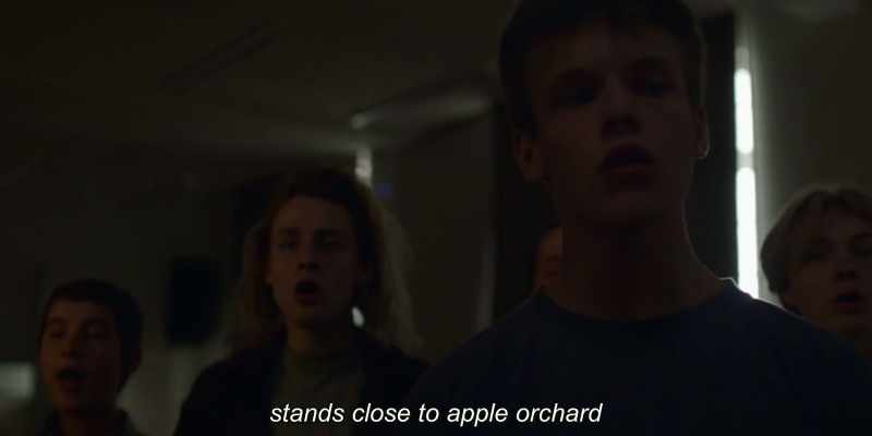 stands close to apple orchard
