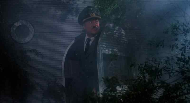 Stay here. Just in case this is German occupied territory, I better go first