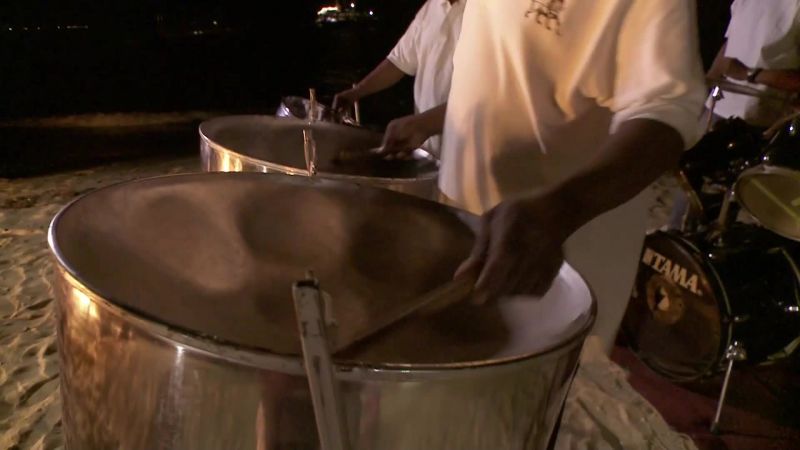 [steel drum music plays]