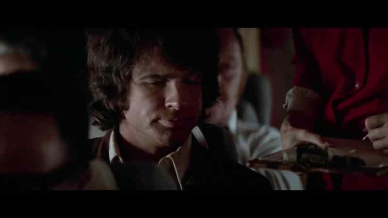 [stewardess] Your name, sir?