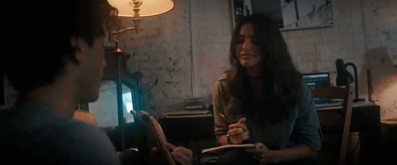 (strumming guitar)
