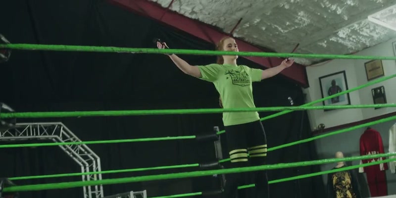 [student wrestlers cheering]