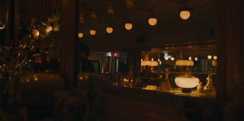 [subdued jazz plays in bar]