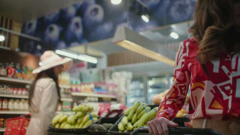 [Supermarket music plays faintly]