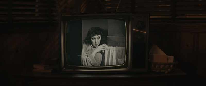 [suspenseful music playing on TV]