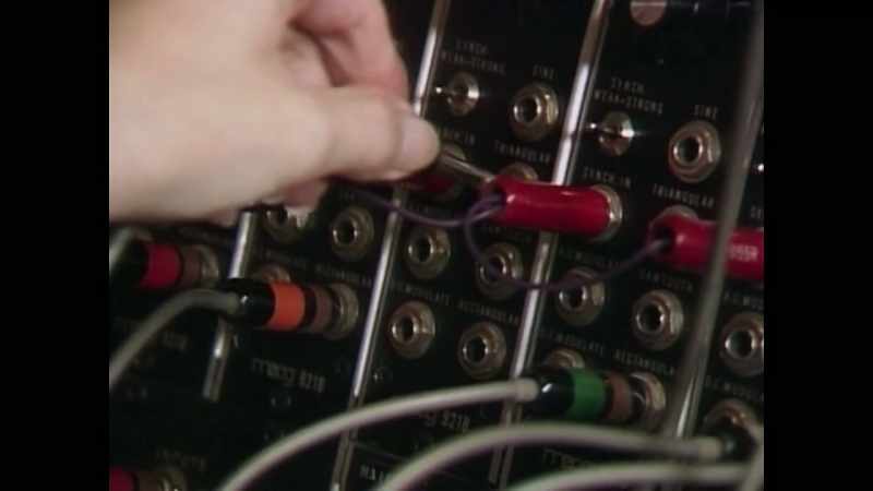 [synthesizer emulating violins, then marimba]
