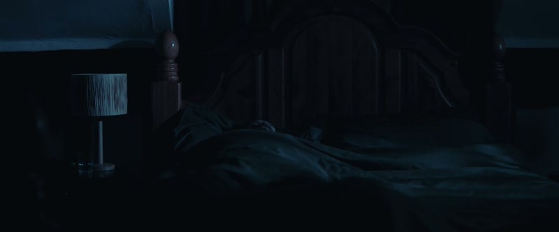 [tense string music playing]