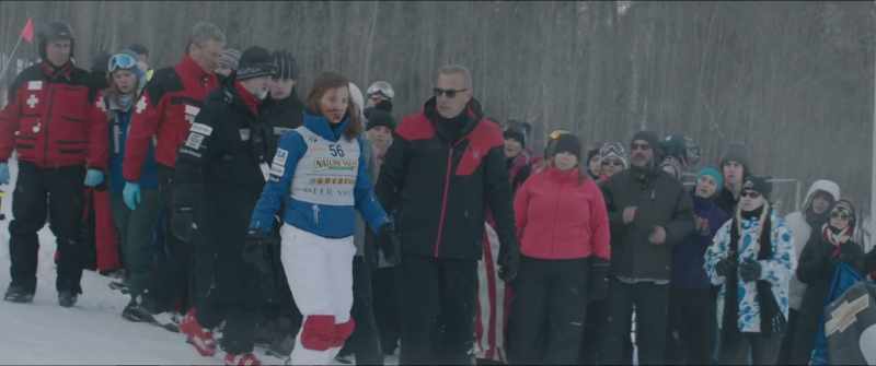 That’s her longtime coach there